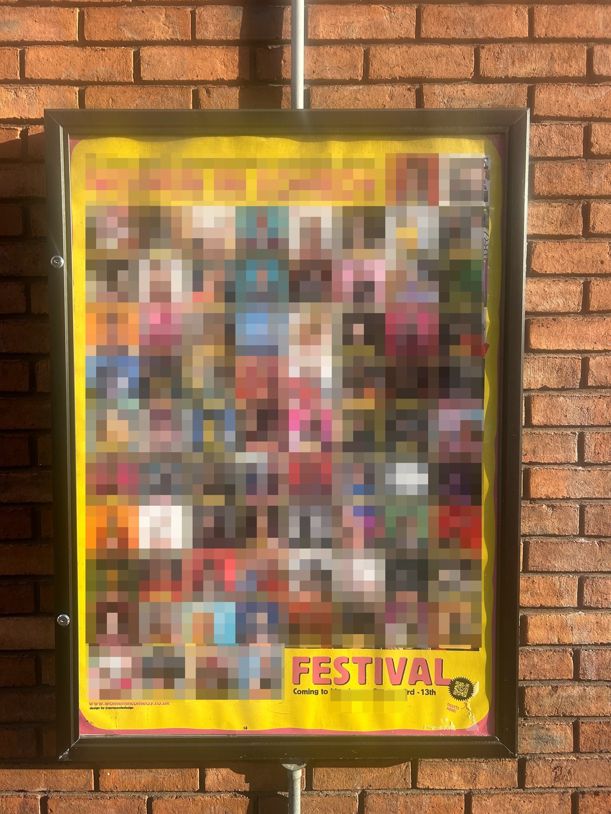A festival poster pinned to a noticeboard